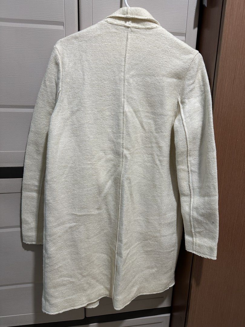 Stradivarius Cream White Trench Coat (Category: Coats, Jackets and Outerwear) located in Manila. Submitted by pmrshops1 (Listing ID 1437063793, Image 2). Description: - Stradivarius cream coat - Size: S - Features a shawl collar - Two front pockets - Textured fabric - Longline design - Great for layering - Versatile style.