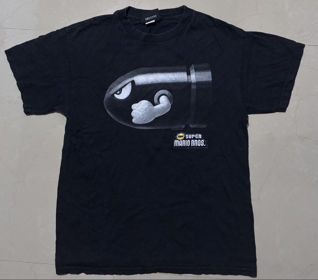Super Mario Bros Promo Shirt (Category: Tshirts & Polo Shirts ) located in Noveleta. Submitted by nep21 (Listing ID 1437070604, Image 1). Description: Super Mario Bros Promo Tee Size M 19.5”W x26.5”L Good Condition.Crack print Selling for 1,500 pesos Cavite location.