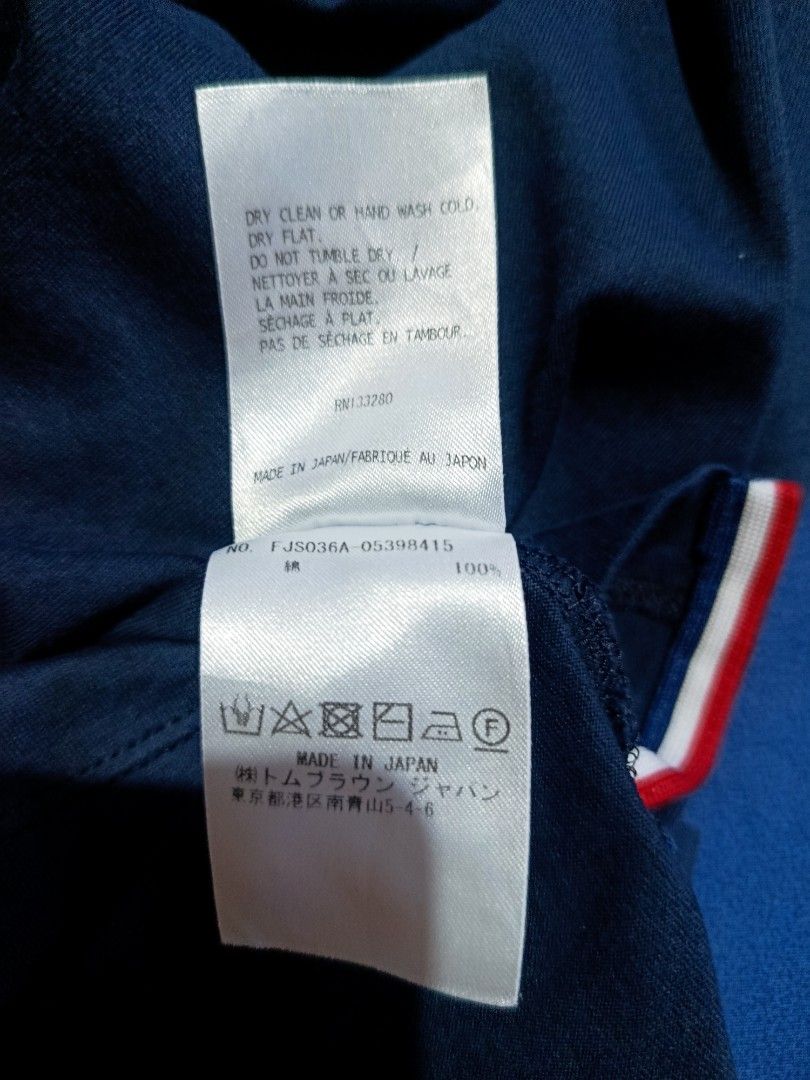 Thom Browne Navy T-shirt (Category: Tshirts & Polo Shirts ) located in Bangued. Submitted by lenc79928 (Listing ID 1437060305, Image 2). Description: - Authentic Thom Browne T-shirt - Navy color - Made in Japan - Size: XS-S (fits like) - Material: 100% cotton - Features: Crew neck, short sleeves - Includes Thom Browne New York label - Color Rate: 9/10.