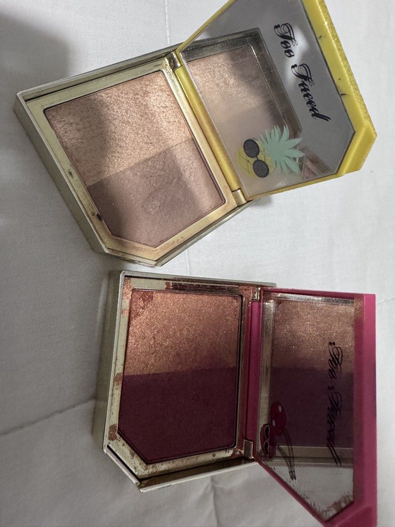 Too Faced Pineapple & Cherry Blush Duo (Category: Makeup) located in Manila. Submitted by decluterthings888 (Listing ID 1437202884, Image 1). Description: - Two Too Faced blush duos for sale! - Pineapple Paradise & Bronzer: - Yellow case with glittery pineapple design. - Fruit Cocktail Blush Duo in Cherry Bomb: - Pink case with cherry designs. - Both duos include a mirror and are in compact cases..
