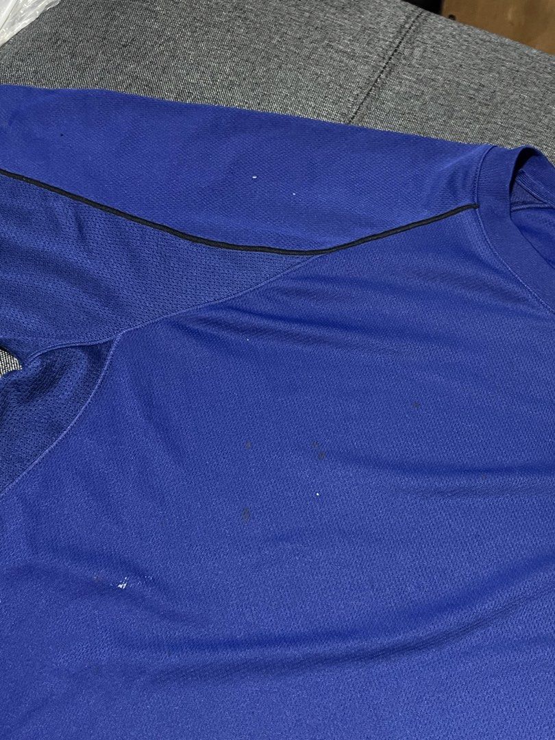 Uniqlo Blue Athletic Drifit Shirt (Category: Tshirts & Polo Shirts ) located in Marikina City. Submitted by d.clutters (Listing ID 1437116433, Image 3). Description: - Blue athletic t-shirt - Black accents - Crew neck - Short sleeves - Some spots on front - Breathable, possibly moisture-wicking material - Suitable for sports or casual wear.