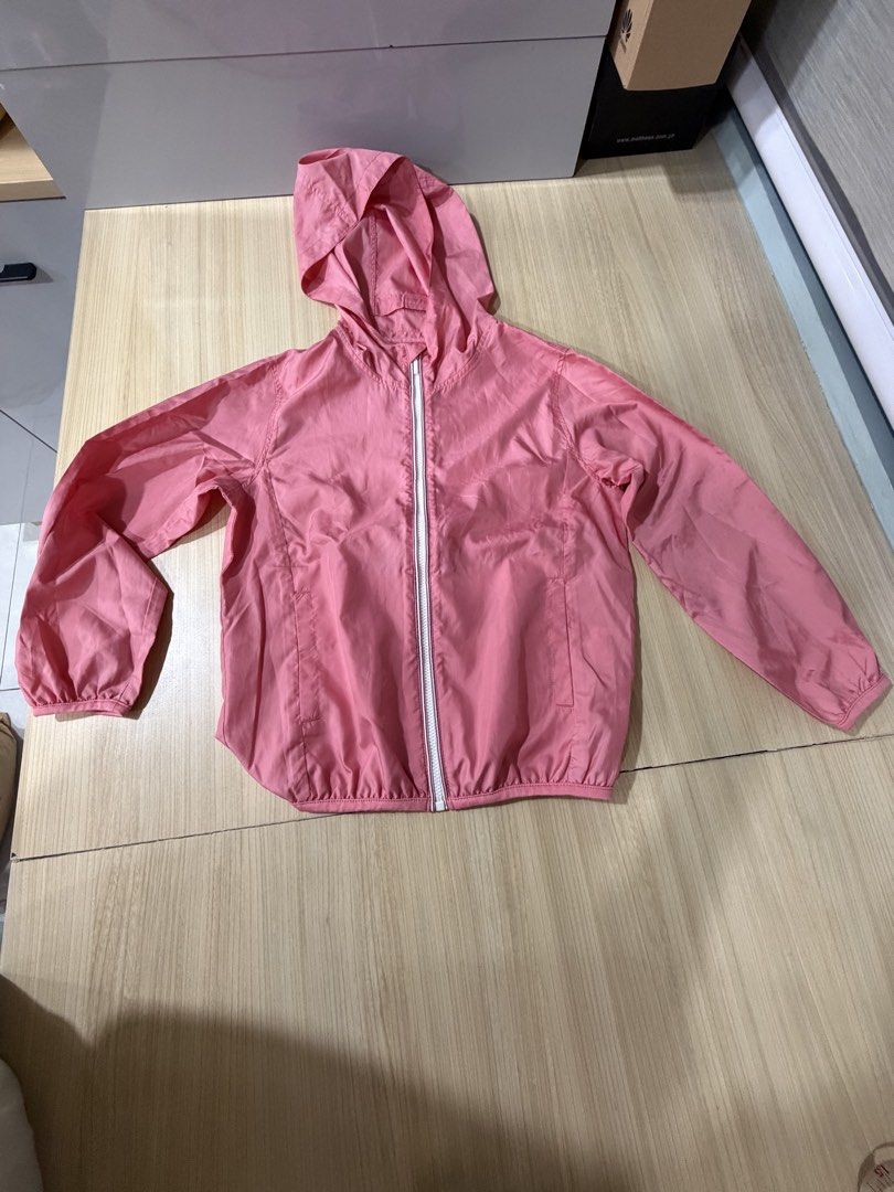 Uniqlo Kids Pink Jacket (Category: Babies & Kids Fashion) located in Mandaluyong City. Submitted by jpc0708 (Listing ID 1437129864, Image 1). Description: - Uniqlo Kids pink jacket with hood - Size 120 - Made in Vietnam - Material: 100% polyester - Features a white zipper - Lightweight and suitable for layering - Measurements in photos.