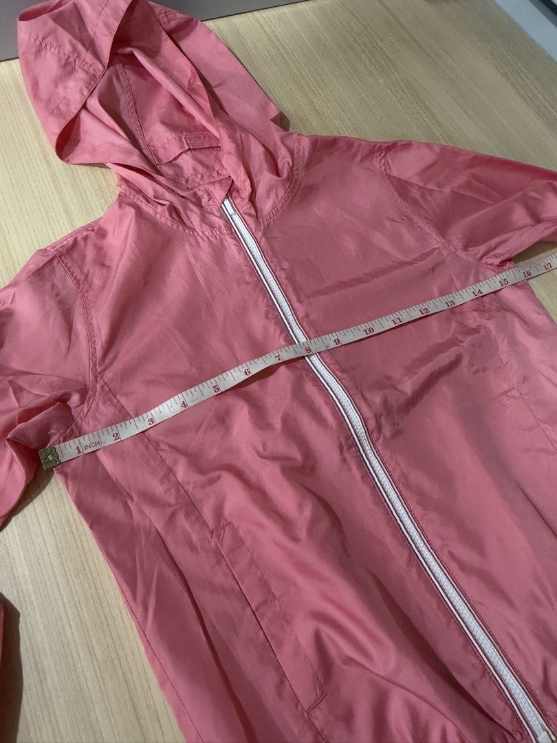 Uniqlo Kids Pink Jacket (Category: Babies & Kids Fashion) located in Mandaluyong City. Submitted by jpc0708 (Listing ID 1437129864, Image 3). Description: - Uniqlo Kids pink jacket with hood - Size 120 - Made in Vietnam - Material: 100% polyester - Features a white zipper - Lightweight and suitable for layering - Measurements in photos.