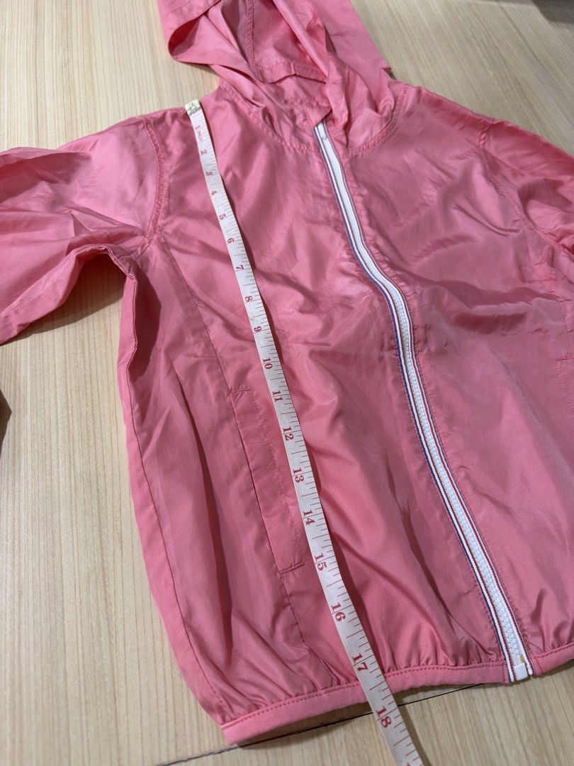 Uniqlo Kids Pink Jacket (Category: Babies & Kids Fashion) located in Mandaluyong City. Submitted by jpc0708 (Listing ID 1437129864, Image 2). Description: - Uniqlo Kids pink jacket with hood - Size 120 - Made in Vietnam - Material: 100% polyester - Features a white zipper - Lightweight and suitable for layering - Measurements in photos.