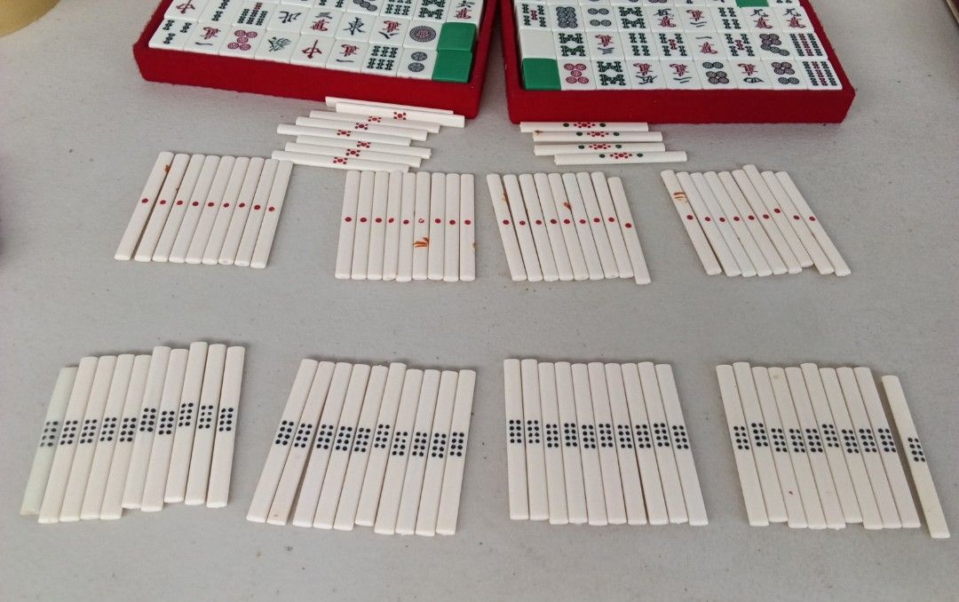 Japan Vintage Mini Mahjong Set with Case Mini Size (Category: Board Games & Puzzles) located in Bulacan. Submitted by amarijapansurplus (Listing ID 1437100905, Image 2). Description: - Complete vintage Minis Size Mahjong set - Includes tiles, racks, dice, and case - Case features a red interior and a handle - Tiles are white with black and green markings - Comes with a set of instructions.