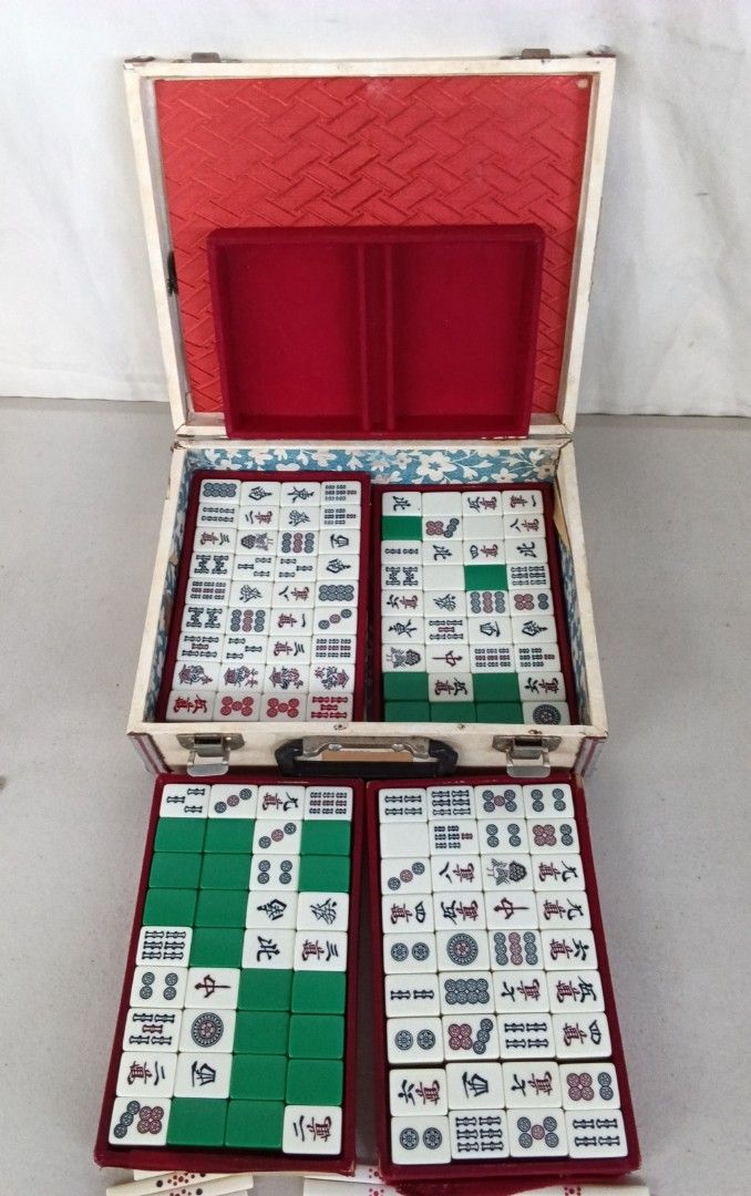 Vintage MINI Mahjong Set with Case mini size (Category: Board Games & Puzzles) located in Bulacan. Submitted by amarijapansurplus (Listing ID 1437107543, Image 3). Description: - Vintage mini size mahjong set (144 tiles, 88sticks) - Includes tiles, racks, and case - Tiles feature green and white designs - Red interior case with handle - Includes a red "東" tile - no dice.