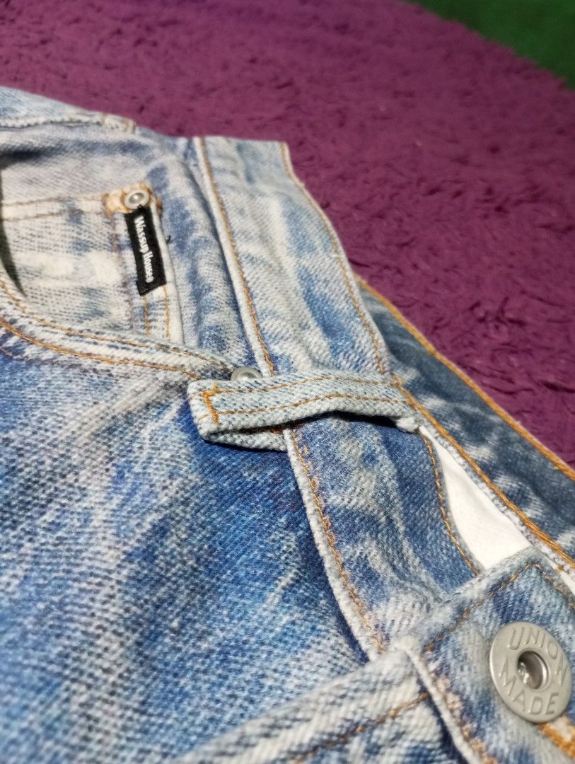 Wassup House Jeans (Category: Jeans) located in Manila. Submitted by johnpaulnoga29 (Listing ID 1437066239, Image 3). Description: Light wash denim jeans from Wassup House. Features a classic five-pocket design with a straight leg fit. The jeans have a button and zipper closure. The back pocket has a Wassup House label. The jeans have some fading and distressing..