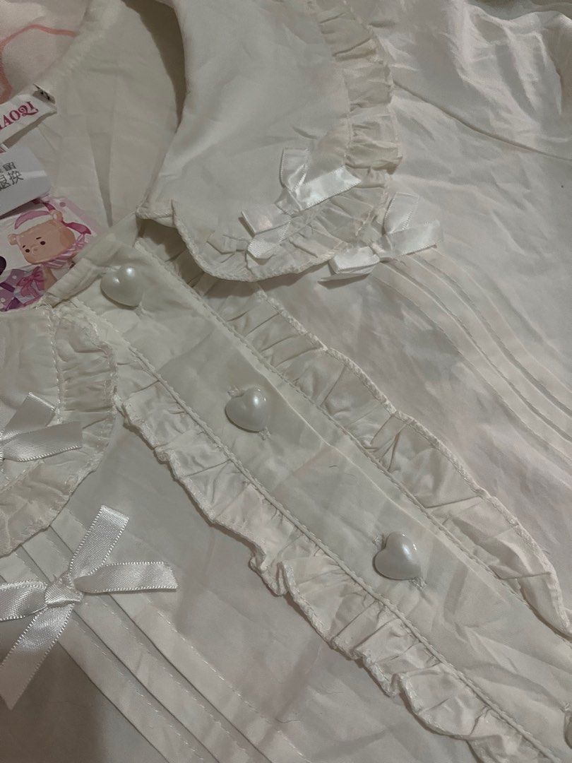 White Coquette Polo Ruffles Top Blouse (Category: Blouses) located in Santa Rosa. Submitted by czescakeeee (Listing ID 1437095230, Image 2). Description: SUPER CUTIE!!!! .
