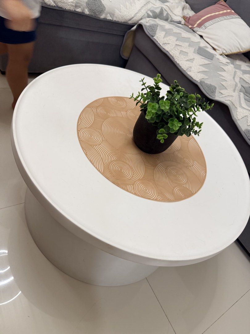 White Round Coffee Table (Category: Tables & Sets) located in Batangas. Submitted by belaluz09 (Listing ID 1437102888, Image 2). Description: - Round coffee table - White base and top - Sturdy and modern design - Ideal for living rooms and lounges Hard plastic 26 inches please see photos to appreciate Location 📍Batangas City/ Pasig payment: COD via lalamove BDO or Gcash.
