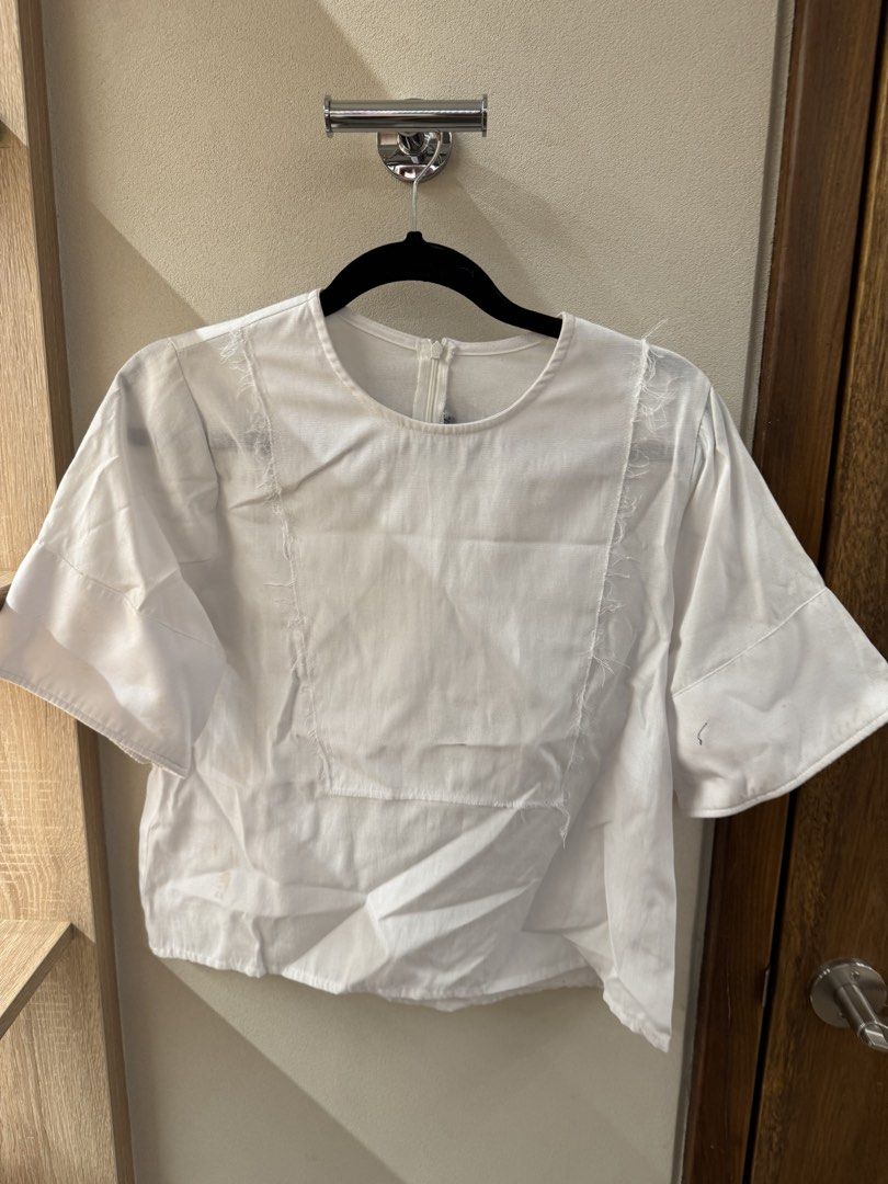 White Short Sleeve Top (Category: Blouses) located in San Juan City. Submitted by outwithit (Listing ID 1437050339, Image 1). Description: Dm for more information -More pictures about the product -Close up pictures -Type of material RFS: Decluttering Can negotiate if buying 2 or more items Delivery fee will be shouldered by buyer .