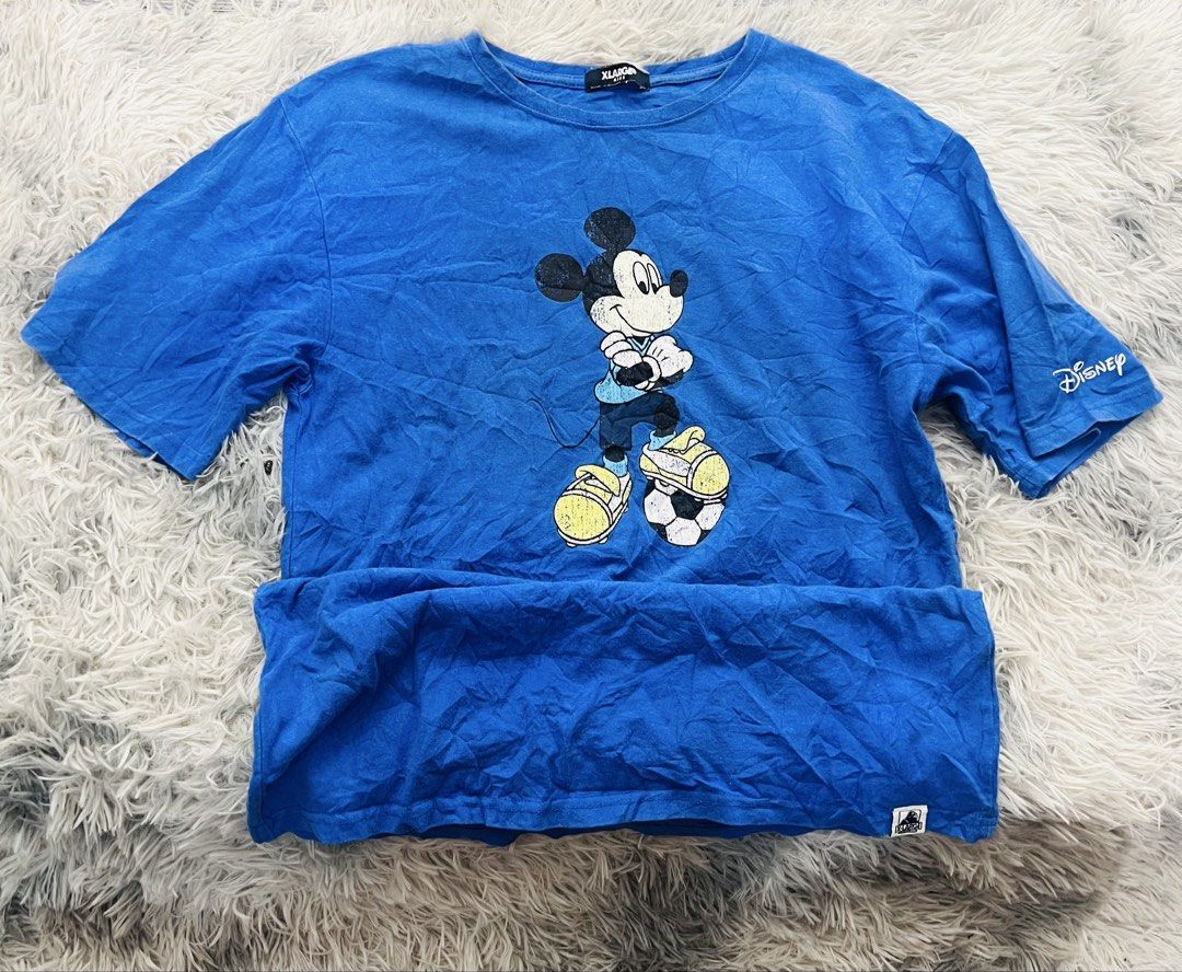 XLARGE Disney Mickey Mouse T-shirt (Category: Tshirts & Polo Shirts ) located in Manila. Submitted by zealocean.1db413 (Listing ID 1437035274, Image 2). Description: - Blue XLARGE T-shirt - Features a Mickey Mouse graphic on the front - Disney logo on the sleeve - XLARGE logo with gorilla graphic on the back - Crew neck - Short sleeves.