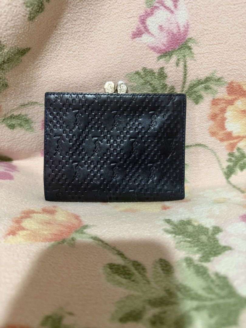 YSL Embossed Leather Wallet (Category: Luxury Bags & Wallets) located in San Pablo. Submitted by prelovedbymistyblue (Listing ID 1437055483, Image 2). Description: - YSL wallet - Embossed pattern - Clasp closure - Dark leather - Compact design -kisslock coin slot Super nice. Measures 4.8 x 3.6 inches when folded. .