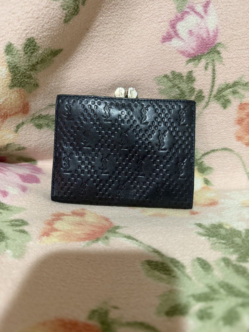 YSL Embossed Leather Wallet (Category: Luxury Bags & Wallets) located in San Pablo. Submitted by prelovedbymistyblue (Listing ID 1437055483, Image 1). Description: - YSL wallet - Embossed pattern - Clasp closure - Dark leather - Compact design -kisslock coin slot Super nice. Measures 4.8 x 3.6 inches when folded. .