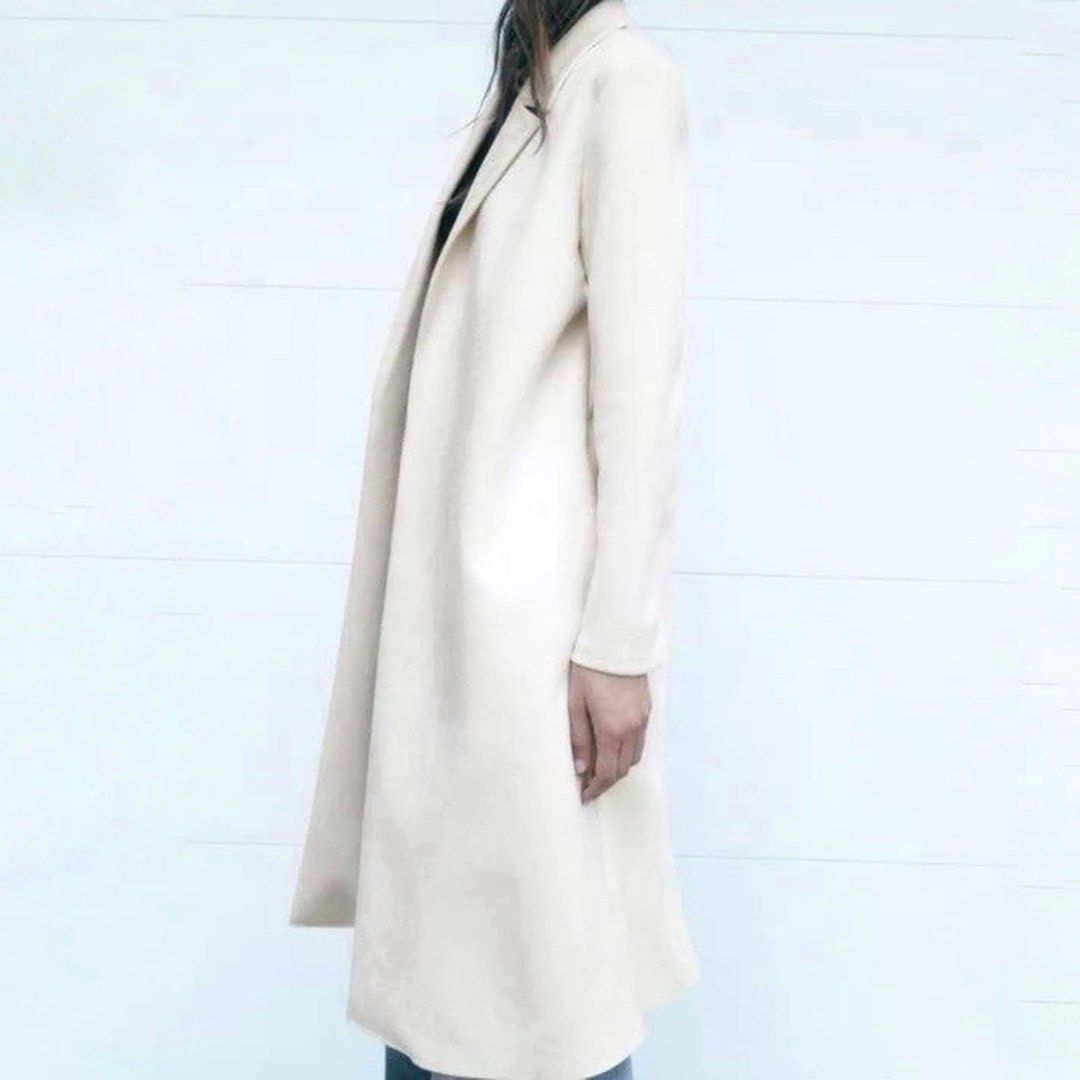 Zara Basic White Coat (Category: Coats, Jackets and Outerwear) located in Manila. Submitted by pmrshops1 (Listing ID 1437063798, Image 2). Description: - Zara Basic white coat - Size: S - Classic open front - Long sleeves - Tailored fit - Soft and smooth texture - Perfect for layering.