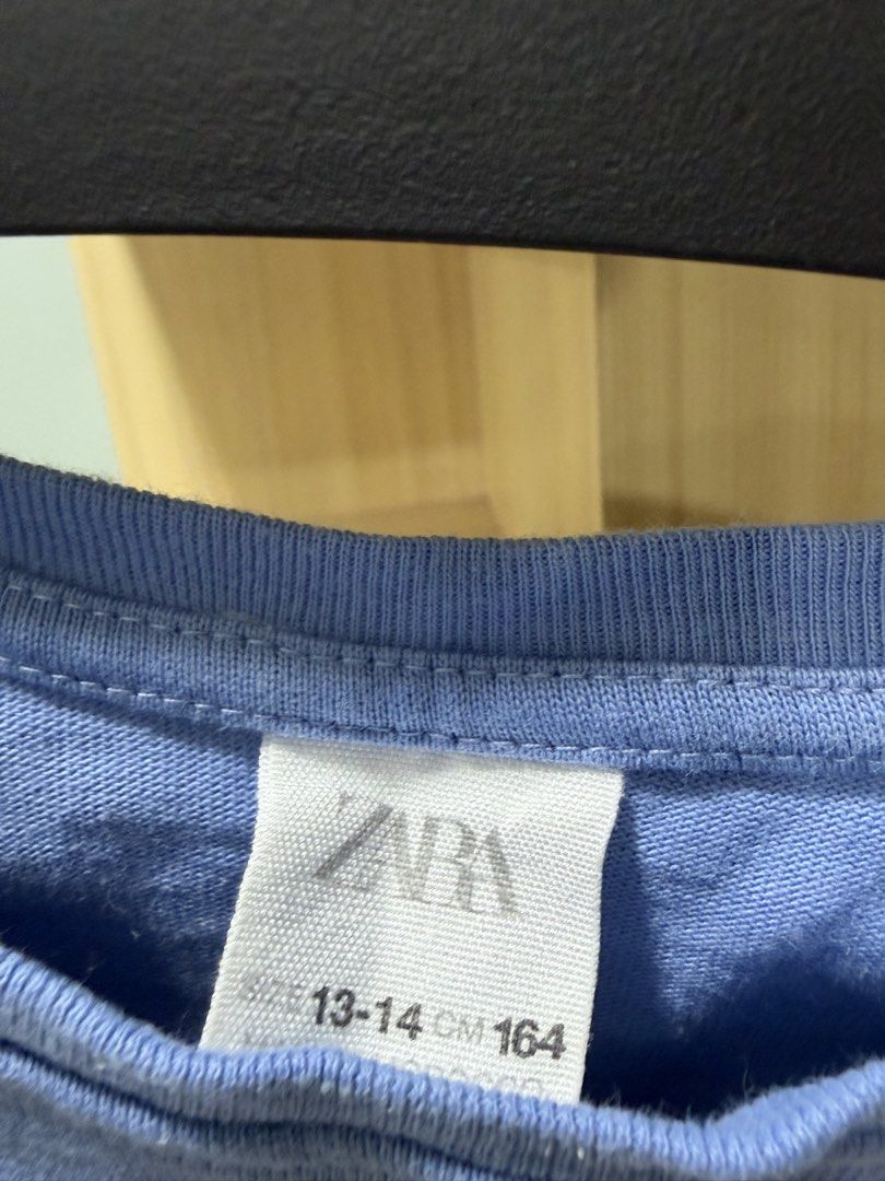 Zara Blue Top (Category: Babies & Kids Fashion) located in Mandaluyong City. Submitted by jpc0708 (Listing ID 1437132418, Image 2). Description: - Zara crop top in a lovely blue color - Size: Fits ages 13-14 (164cm height) - Measurements: Approximately 19 inches long, 16 inches across the chest - Features: Round neck and cap sleeves - Simple and stylish design.