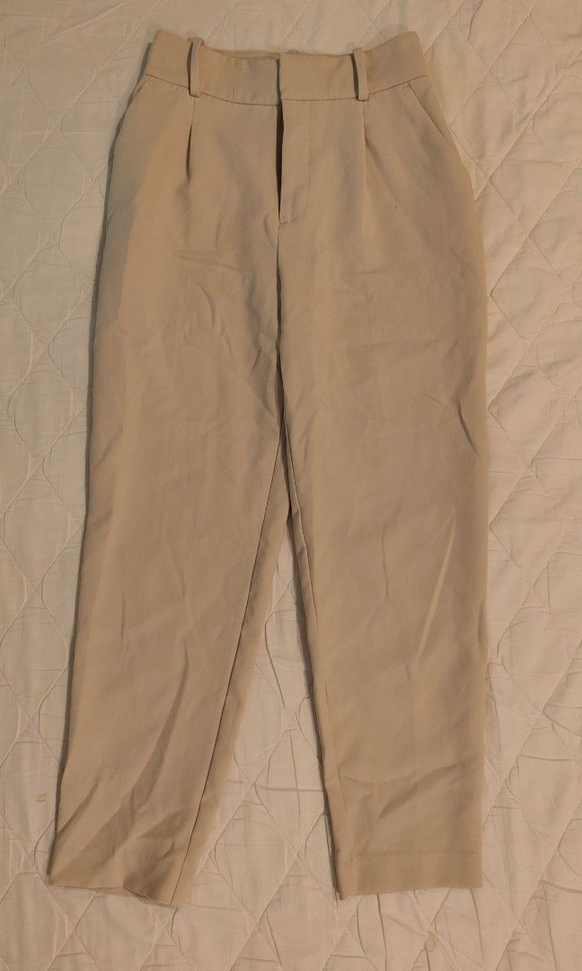 Zara high waisted Cream Trousers (Category: Other Bottoms) located in Makati City. Submitted by shopsaleph (Listing ID 1437093910, Image 2). Description: - cream high-waisted trousers - Pleated front - Straight leg - Lightweight fabric - Two front and two back pockets - Button and zipper closure has a tiny tiny stain.not noticeable when worn .