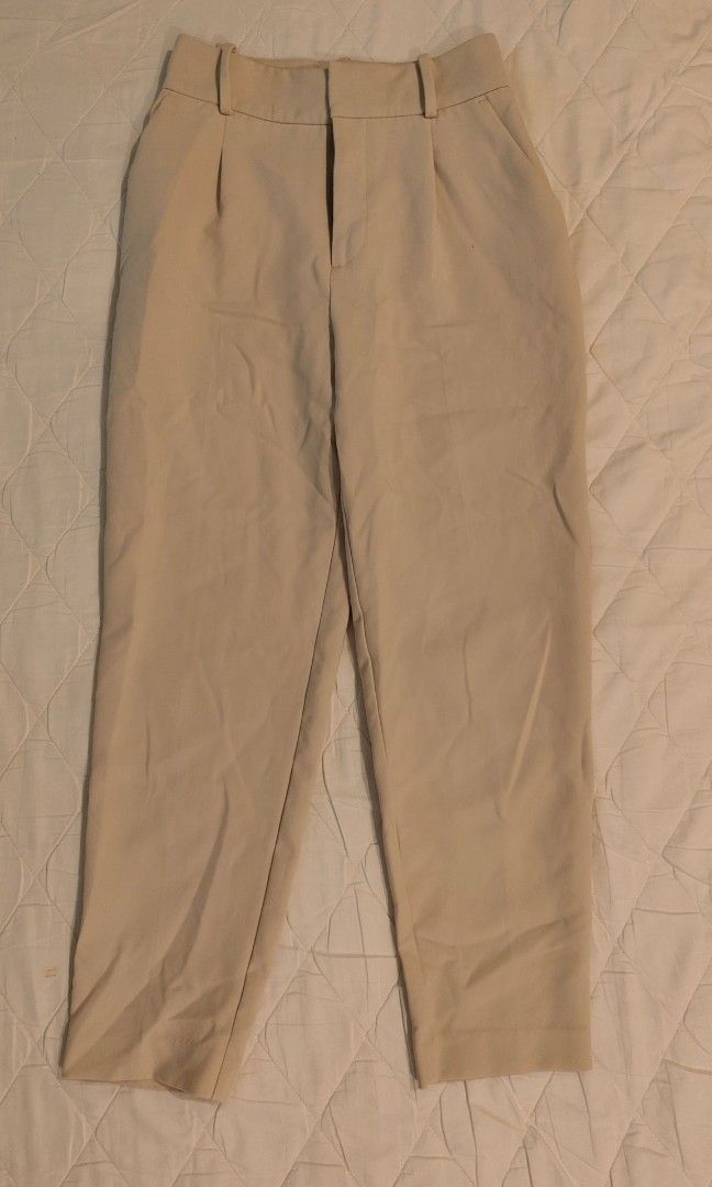 Zara high waisted Cream Trousers (Category: Other Bottoms) located in Makati City. Submitted by shopsaleph (Listing ID 1437093910, Image 1). Description: - cream high-waisted trousers - Pleated front - Straight leg - Lightweight fabric - Two front and two back pockets - Button and zipper closure has a tiny tiny stain.not noticeable when worn .