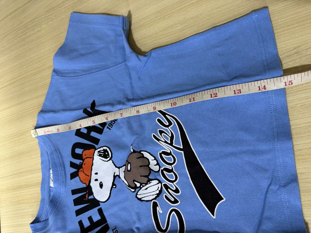 Zara Peanuts Snoopy T-shirt (Category: Babies & Kids Fashion) located in Mandaluyong City. Submitted by jpc0708 (Listing ID 1437133844, Image 3). Description: - Zara Snoopy T-shirt - Size: 6-7 (120cm) - Graphic: Snoopy with "New York" and "1950" - Made in Morocco - Style: Short sleeves, round neckline - Chest measurement: Approximately 14 inches.
