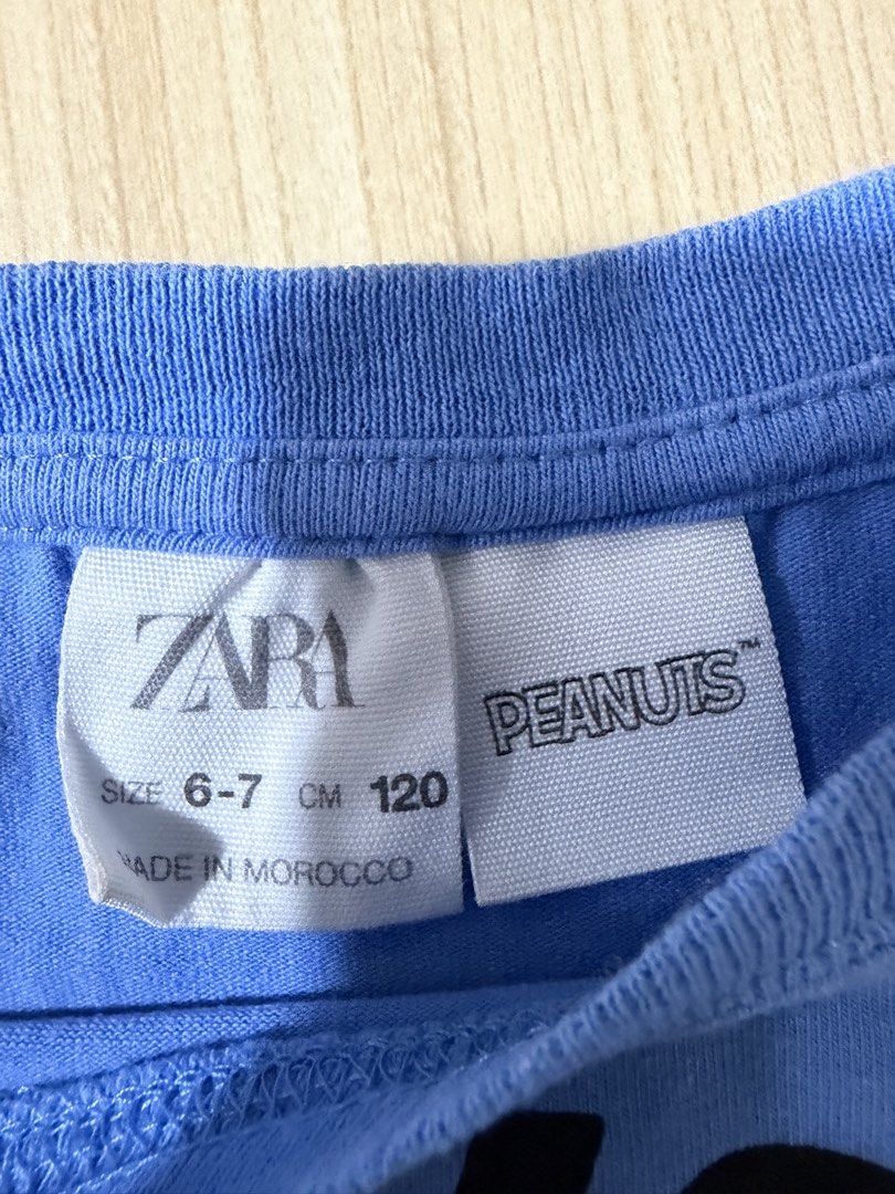 Zara Peanuts Snoopy T-shirt (Category: Babies & Kids Fashion) located in Mandaluyong City. Submitted by jpc0708 (Listing ID 1437133844, Image 2). Description: - Zara Snoopy T-shirt - Size: 6-7 (120cm) - Graphic: Snoopy with "New York" and "1950" - Made in Morocco - Style: Short sleeves, round neckline - Chest measurement: Approximately 14 inches.