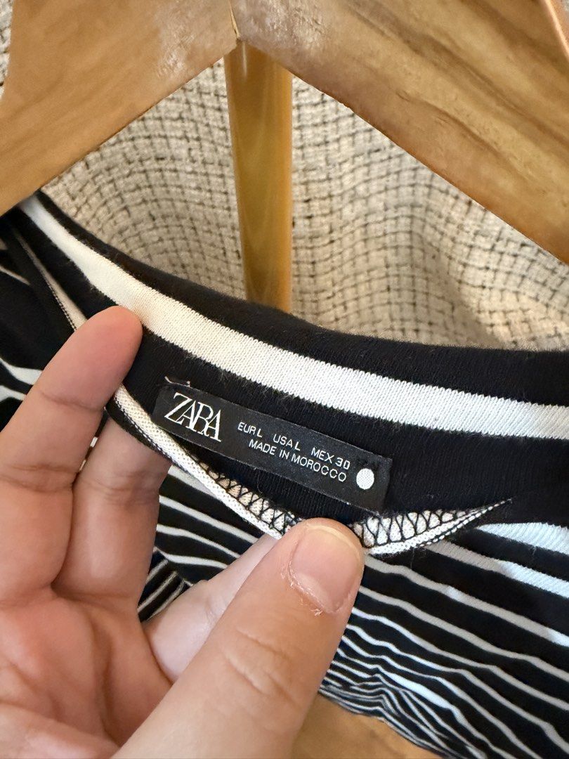 Zara Striped Boat Neck Top (Category: Sleeveless) located in Tarlac. Submitted by emoy3 (Listing ID 1437067599, Image 2). Description: - Zara boat neck top - Size: L - Color: Black and white stripes - Features an asymmetrical design - Made in Morocco - sleeveless on one side.