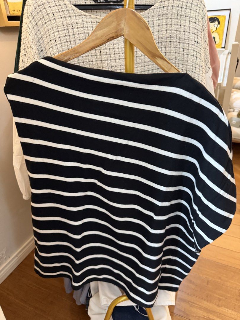 Zara Striped Boat Neck Top (Category: Sleeveless) located in Tarlac. Submitted by emoy3 (Listing ID 1437067599, Image 3). Description: - Zara boat neck top - Size: L - Color: Black and white stripes - Features an asymmetrical design - Made in Morocco - sleeveless on one side.
