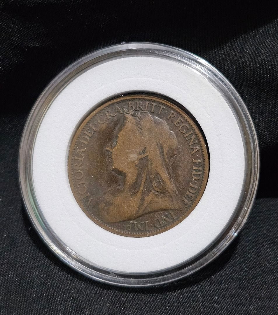 1897 British Penny Coin (Category: Currency) located in Manila. Submitted by yatskiex2026 (Listing ID 1437343445, Image 2). Description: - 1897 British Penny Coin - Features Queen Victoria's portrait - Displays seated Britannia - Includes protective holder - Year and inscriptions are visible.
