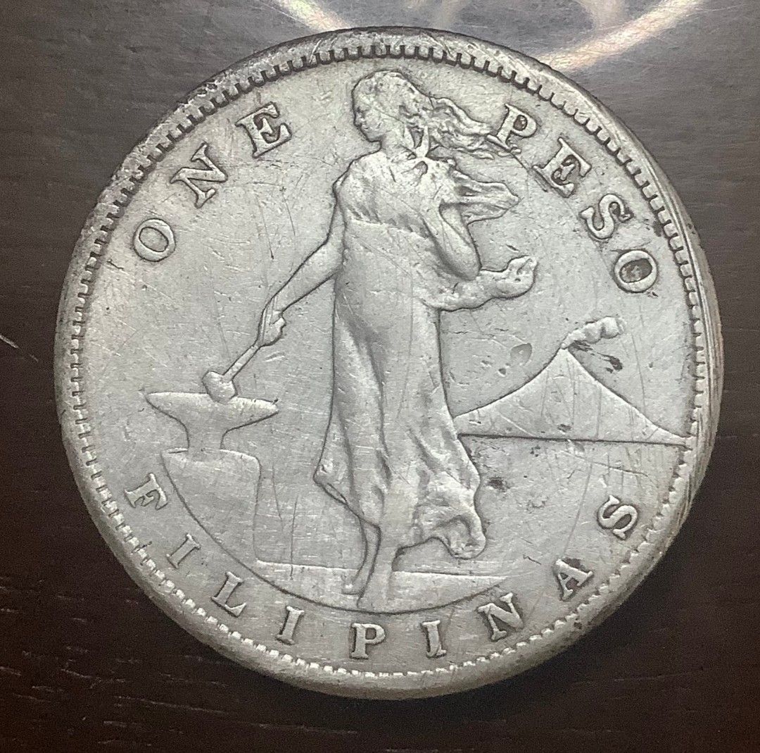 1907 Philippines One Peso Coin (Category: Currency) located in Caloocan City. Submitted by rm.diaz (Listing ID 1437314068, Image 1). Description: - 1907 Philippines One Peso coin. - Obverse: Woman with hammer and anvil, "ONE PESO", "FILIPINAS". - Reverse: Eagle with shield, "UNITED STATES OF AMERICA", "1907". - A collectible coin..