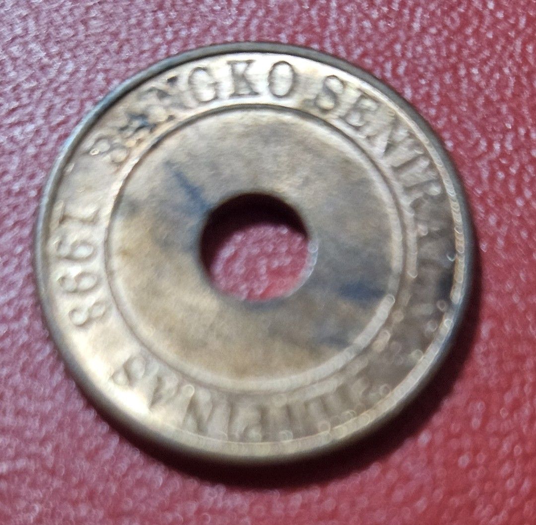 2014 Philippine 5 Sentimo Coin (Category: Currency) located in Caloocan City. Submitted by rm.diaz (Listing ID 1437328191, Image 2). Description: - Two Philippine 5 Sentimo coins available. - Coin 1: 1993 issue, features "Bangko Sentral ng Pilipinas". - Coin 2: 2014 issue, features "Republika ng Pilipinas". - Both coins have a hole in the center..