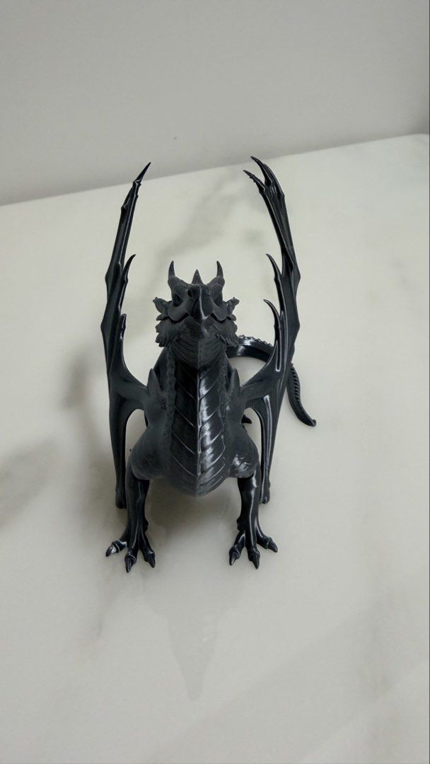 3D Printed Black Dragon Figurine (Category: Toys & Games) located in Singapore. Submitted by pure_lucia (Listing ID 1437285793, Image 3). Description: - 3D-printed dragon figurine - Intricate scales and wings - Excellent condition - No visible damage - Ideal for fantasy collections - Great gift for dragon lovers.