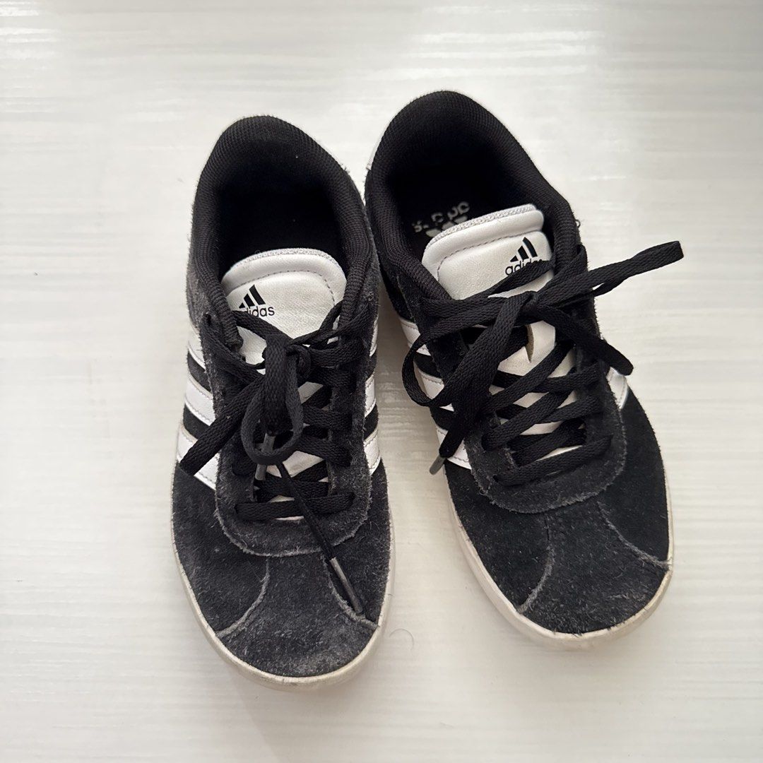 Adidas Black and White Sneakers (Category: Babies & Kids Fashion) located in Cavite. Submitted by gccwardrobe (Listing ID 1437276293, Image 1). Description: - Adidas black and white sneakers - US size 13k - Adidas logo on tongue and side - Made in Vietnam - Black laces - White soles - Suede-like material - Manufacturing date: 08/23.