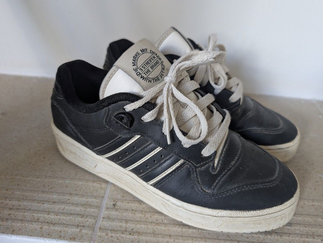 Adidas Rivalry Low (Category: Sneakers) located in Santa Rosa. Submitted by vansting (Listing ID 1437217137, Image 1). Description: - Adidas black and white sneakers - Features Adidas logo and three stripes - Made in Vietnam - Size: US 5, UK 4.5, FR 37, JP 230, CHN 230 - White laces and white sole slightly negotiable.