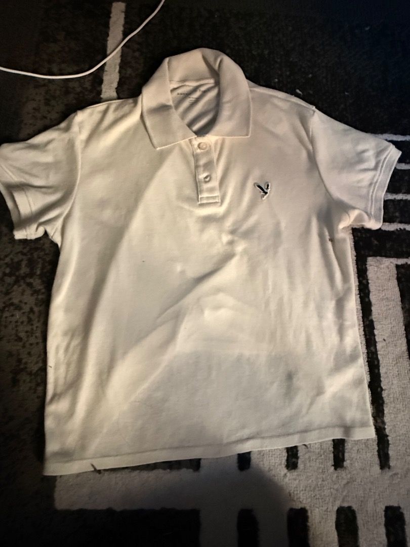 American Eagle White Polo Shirt XS (Category: Shirts) located in Caloocan City. Submitted by kaylashop1 (Listing ID 1437384893, Image 2). Description: - American Eagle white polo shirt - Size: XS - Classic collar - Short sleeves - American Eagle logo on chest - BRAND NEW WITH TAGS!.