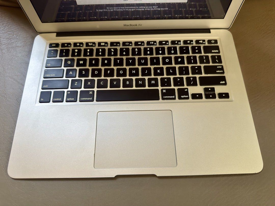 Apple MacBook Air 2015 13 inch (Category: Laptops & Notebooks) located in Paranaque City. Submitted by ohsofancy777 (Listing ID 1437221014, Image 3). Description: - Apple Macbook Air laptop (Silver) - Displays setup welcome screen - Features a keyboard with black keys - Minor scratches on the bottom - Stickers on the top - Charger is not working properly. You have to move it and position it to work but you can buy a replacement online. - RFS is u