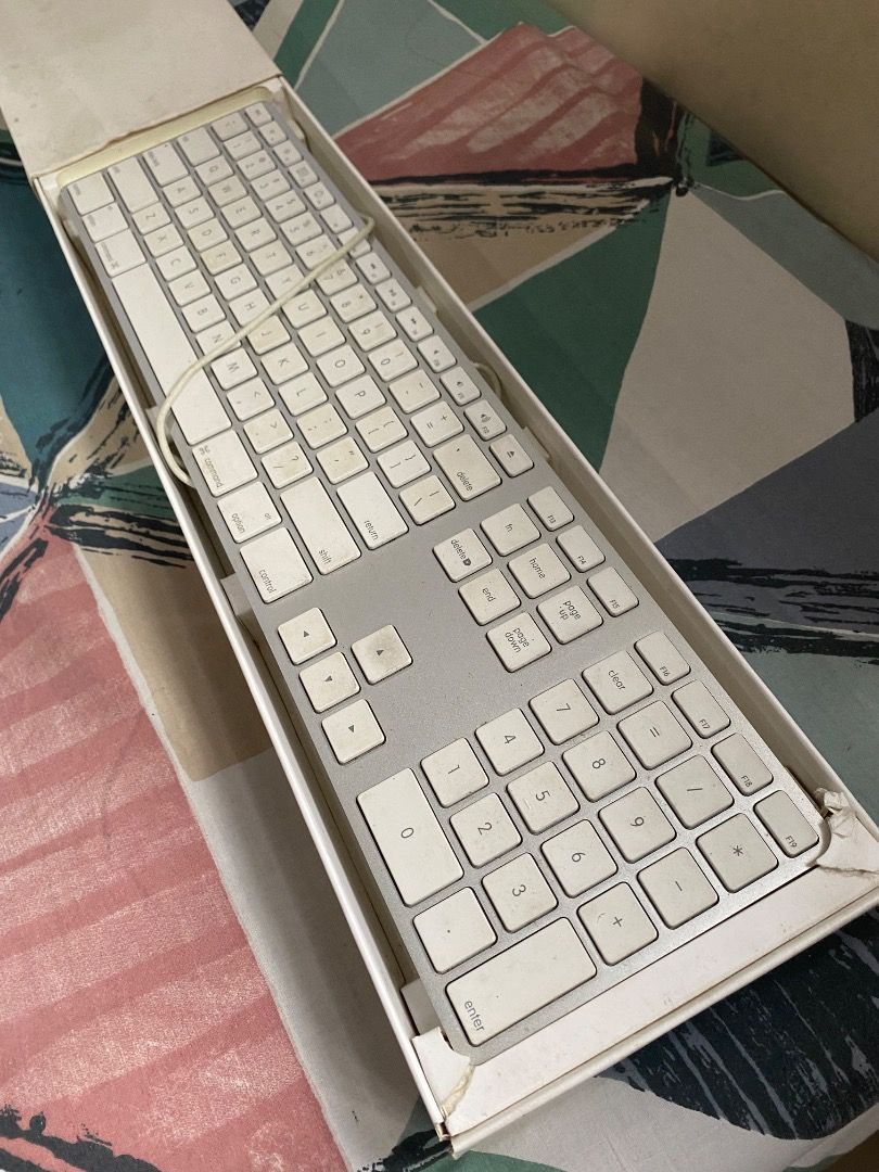 Apple Wired (USB port) Keyboard (Category: Computer Keyboard) located in Quezon City. Submitted by jmgordona (Listing ID 1437272855, Image 3). Description: Brand: Apple Color: Silver base with white keys Not wireless. Has USB cord with it Certain keys do not work so it needs repair Needs cleaning for the keys Overall, still works fine .