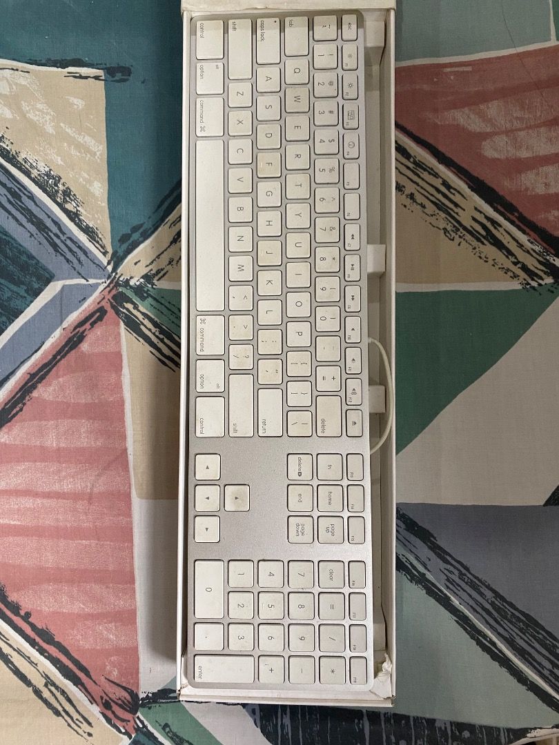 Apple Wired (USB port) Keyboard (Category: Computer Keyboard) located in Quezon City. Submitted by jmgordona (Listing ID 1437272855, Image 1). Description: Brand: Apple Color: Silver base with white keys Not wireless. Has USB cord with it Certain keys do not work so it needs repair Needs cleaning for the keys Overall, still works fine .