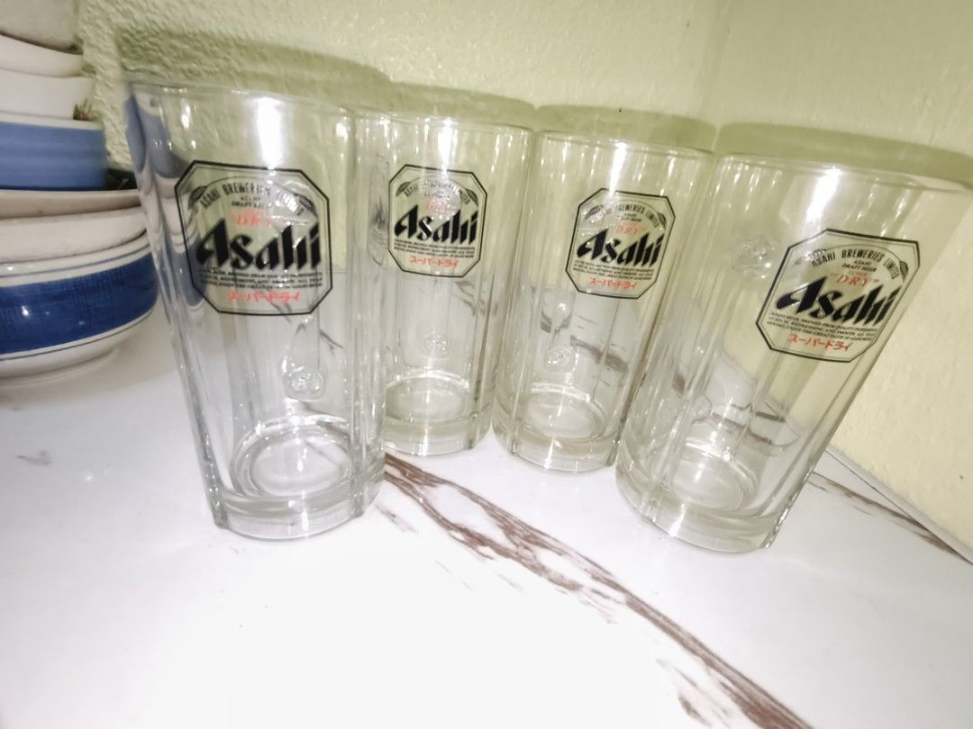 Asahi Beer Glass (Category: Other Kitchenware & Tableware) located in Manila. Submitted by reascheyss51406 (Listing ID 1437288098, Image 1). Description: - Set of 4 Asahi beer glass - Features the Asahi logo - Clear glass design - Includes a handle for easy grip - Perfect for enjoying beer at home - Great gift for beer lovers.