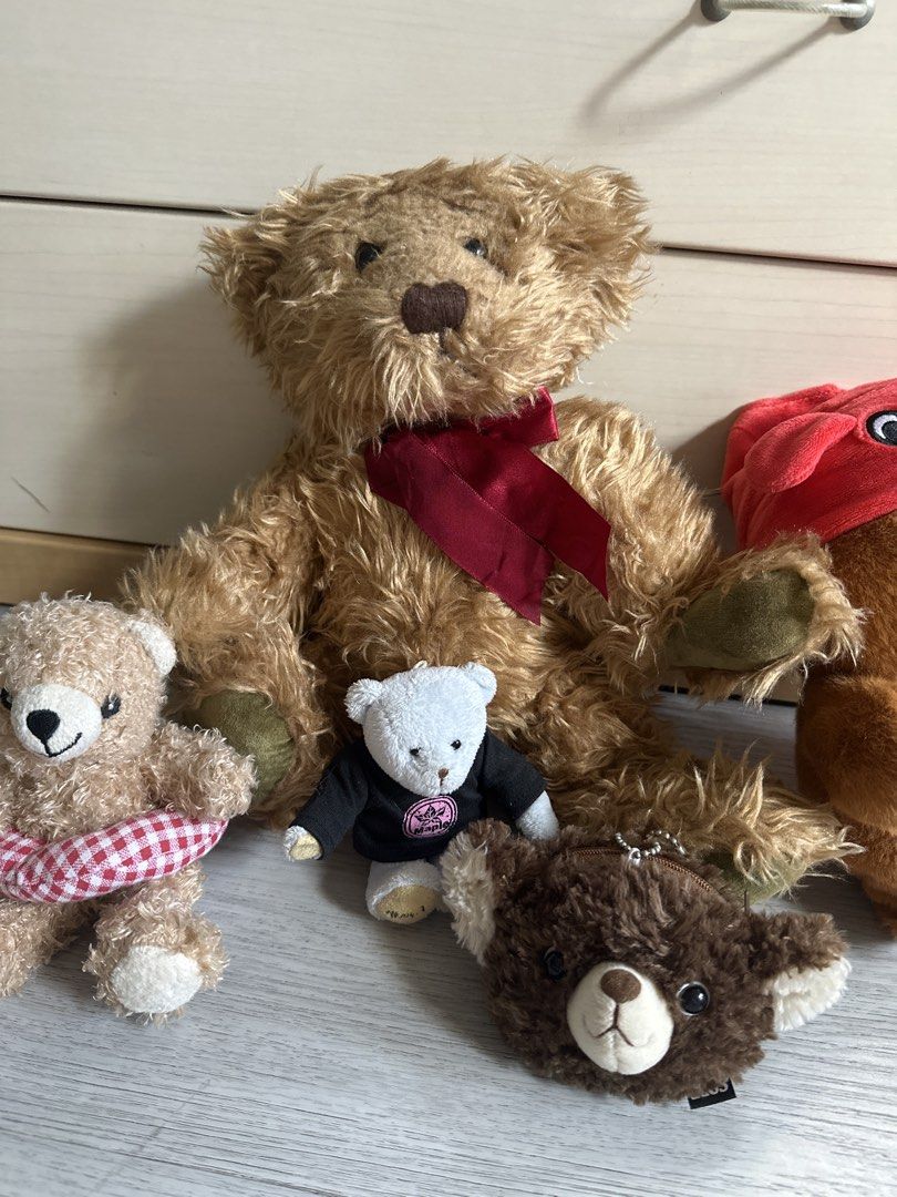Assorted Teddy Bear Plushies (Category: Toys & Games) located in Cainta. Submitted by shopbyyna (Listing ID 1437272360, Image 2). Description: - Adorable teddy bear plushie collection. - Features: - Large brown bear with red ribbon - Small bear with red and white checkered wrap - Small white bear with black shirt - Brown bear keychain - Brown bear with red hat - Various sizes and styles available. - Perfect for collectors and gifts..