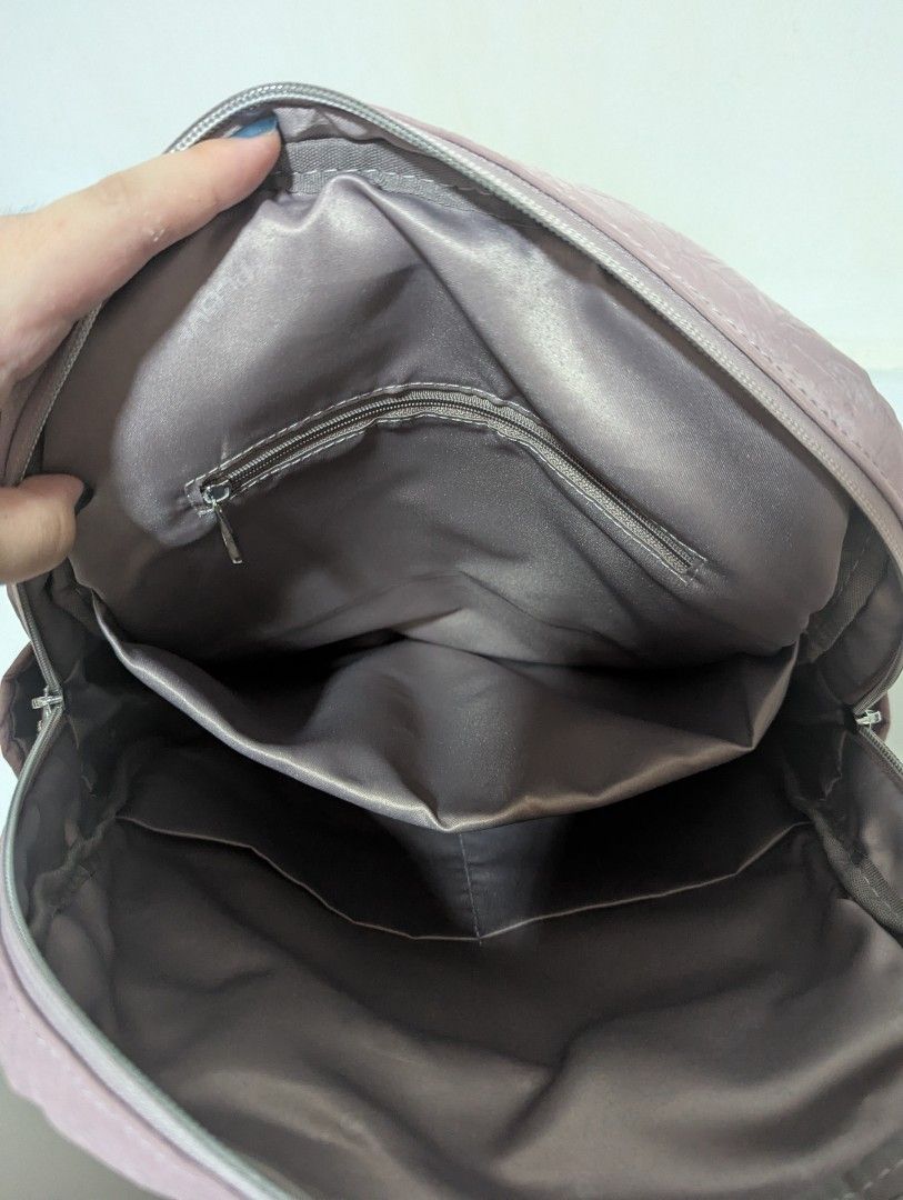 Backpack (Category: Backpacks) located in Singapore. Submitted by pokka332 (Listing ID 1437245576, Image 3). Description: Lightweight with multiple zips and water bottle holders on both sides. Bought from China and originally SGD$40..