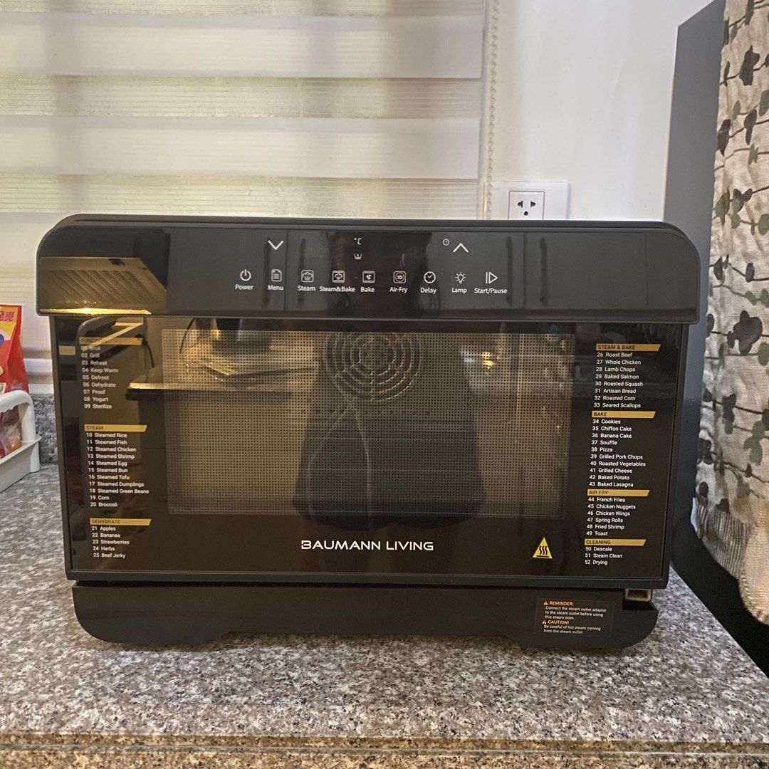Baumann Living Stream 52 multifunction steam oven (Category: Ovens & Toasters) located in Pasig City. Submitted by eulybabes (Listing ID 1437283931, Image 3). Description: Versatile Cooking: This countertop oven combines multiple cooking methods, including air-frying, steaming, convection baking, and dehydration.Capacity and Features: It features a 23-liter capacity, a digital display, and precise temperature controls ranging from 104°F to 446°F.