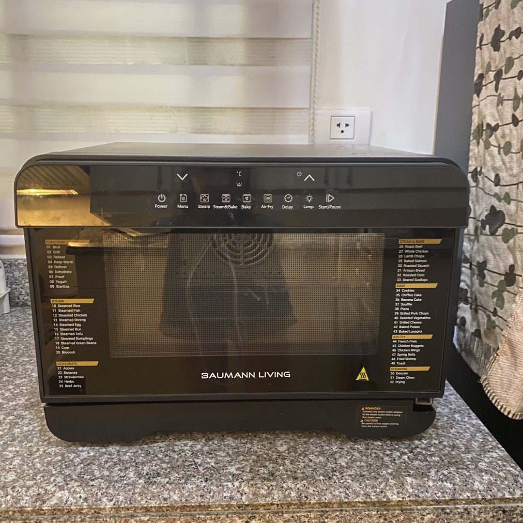 Baumann Living Stream 52 multifunction steam oven (Category: Ovens & Toasters) located in Pasig City. Submitted by eulybabes (Listing ID 1437283931, Image 2). Description: Versatile Cooking: This countertop oven combines multiple cooking methods, including air-frying, steaming, convection baking, and dehydration.Capacity and Features: It features a 23-liter capacity, a digital display, and precise temperature controls ranging from 104°F to 446°F.