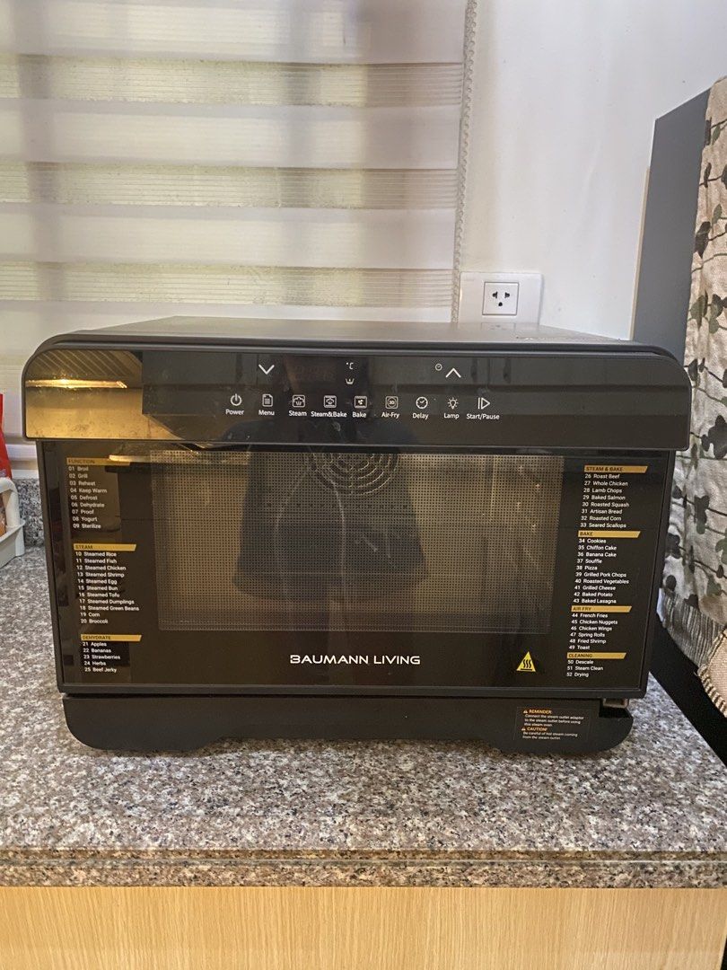 Baumann Living Stream 52 multifunction steam oven (Category: Ovens & Toasters) located in Pasig City. Submitted by eulybabes (Listing ID 1437283931, Image 1). Description: Versatile Cooking: This countertop oven combines multiple cooking methods, including air-frying, steaming, convection baking, and dehydration.Capacity and Features: It features a 23-liter capacity, a digital display, and precise temperature controls ranging from 104°F to 446°F.