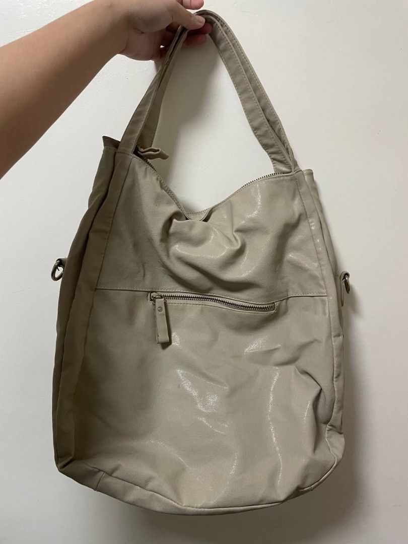 BA-YO Beige Shoulder Bag with Zipper Pockets (Category: Shoulder Bags) located in Makati City. Submitted by claire.1221 (Listing ID 1437244044, Image 1). Description: - Beige shoulder bag - Front zipper pocket - Main compartment with zipper closure.