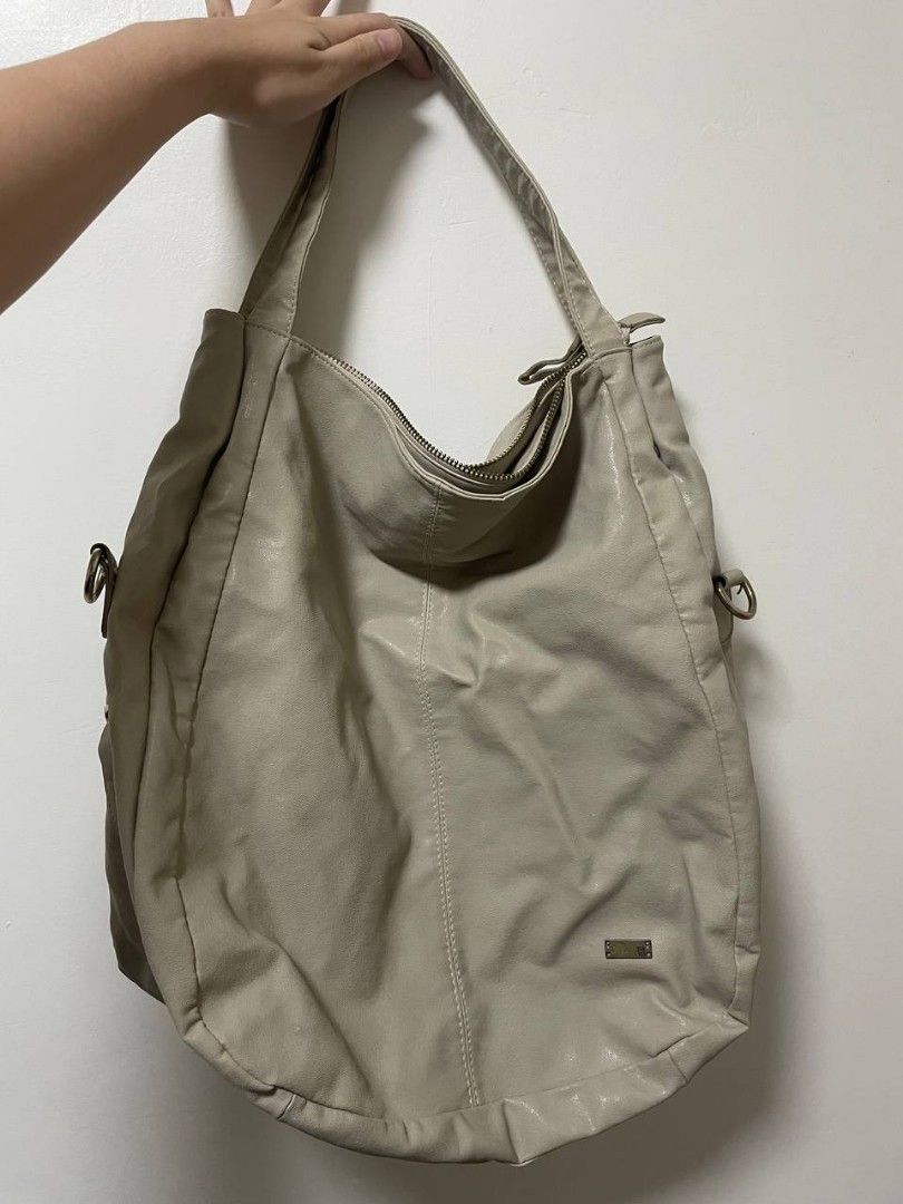 BA-YO Beige Shoulder Bag with Zipper Pockets (Category: Shoulder Bags) located in Makati City. Submitted by claire.1221 (Listing ID 1437244044, Image 2). Description: - Beige shoulder bag - Front zipper pocket - Main compartment with zipper closure.