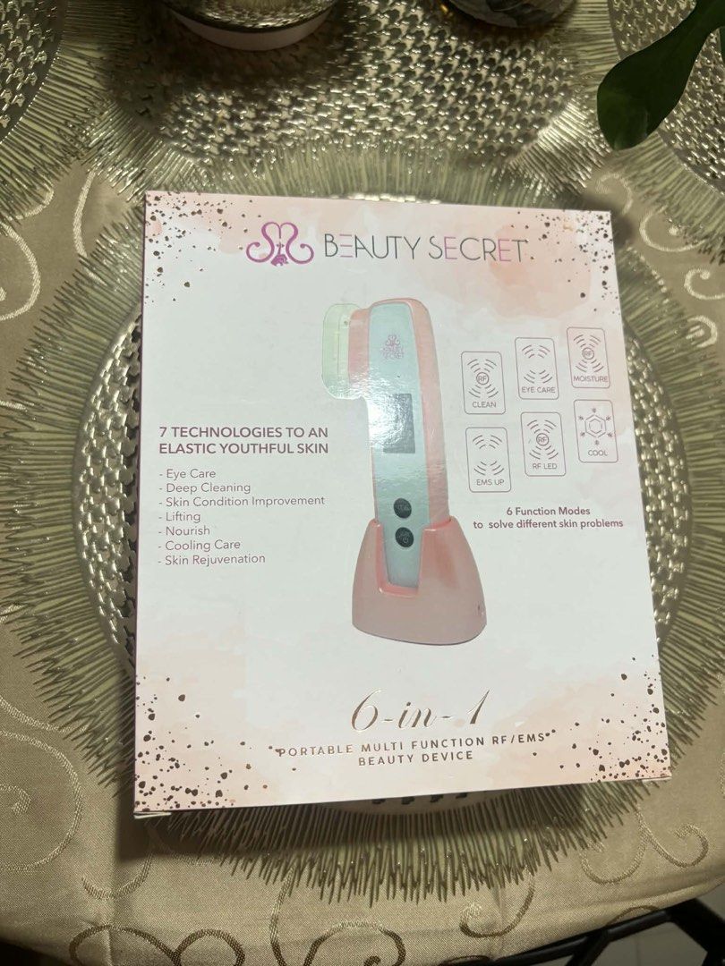 Beauty Secret 6-in-1 Portable Multi-Function RF/EMS Device (Category: Face Care) located in Paranaque City. Submitted by abbysen.creactivatio554 (Listing ID 1437271009, Image 1). Description: - Beauty Secret 6-in-1 device for elastic, youthful skin. - Features 7 skin-enhancing technologies. - Offers 6 function modes: eye care, deep cleaning, skin rejuvenation, and more. - Stylish pink and white design. - Includes a convenient charging base. - Eas