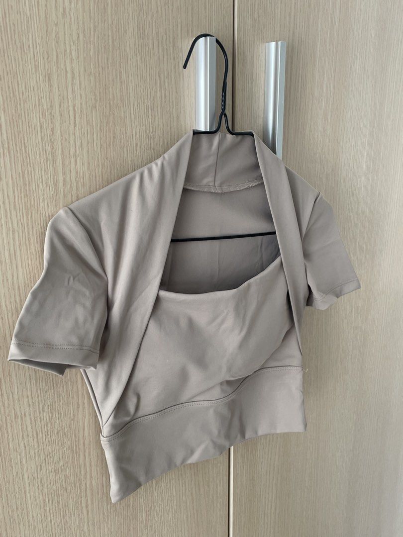 Beige Yoga Crop Top XS (Category: Others Tops) located in Manila. Submitted by hellonuggy (Listing ID 1437332196, Image 2). Description: - Beige XS yoga crop top - Includes bra pads - Ideal for yoga and other activities - Never worn.
