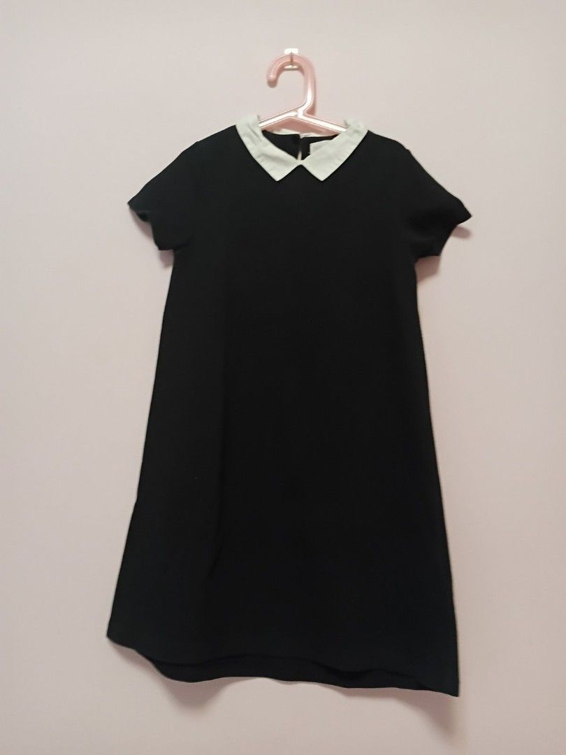 Black Dress with White Collar (Category: Babies & Kids Fashion) located in Antipolo. Submitted by nike_winwin (Listing ID 1437270022, Image 1). Description: - Black dress - White collar - Short sleeves - Simple, elegant design - Smooth fabric - Suitable for casual and formal occasions - Versatile wardrobe piece - Kid's size 140.