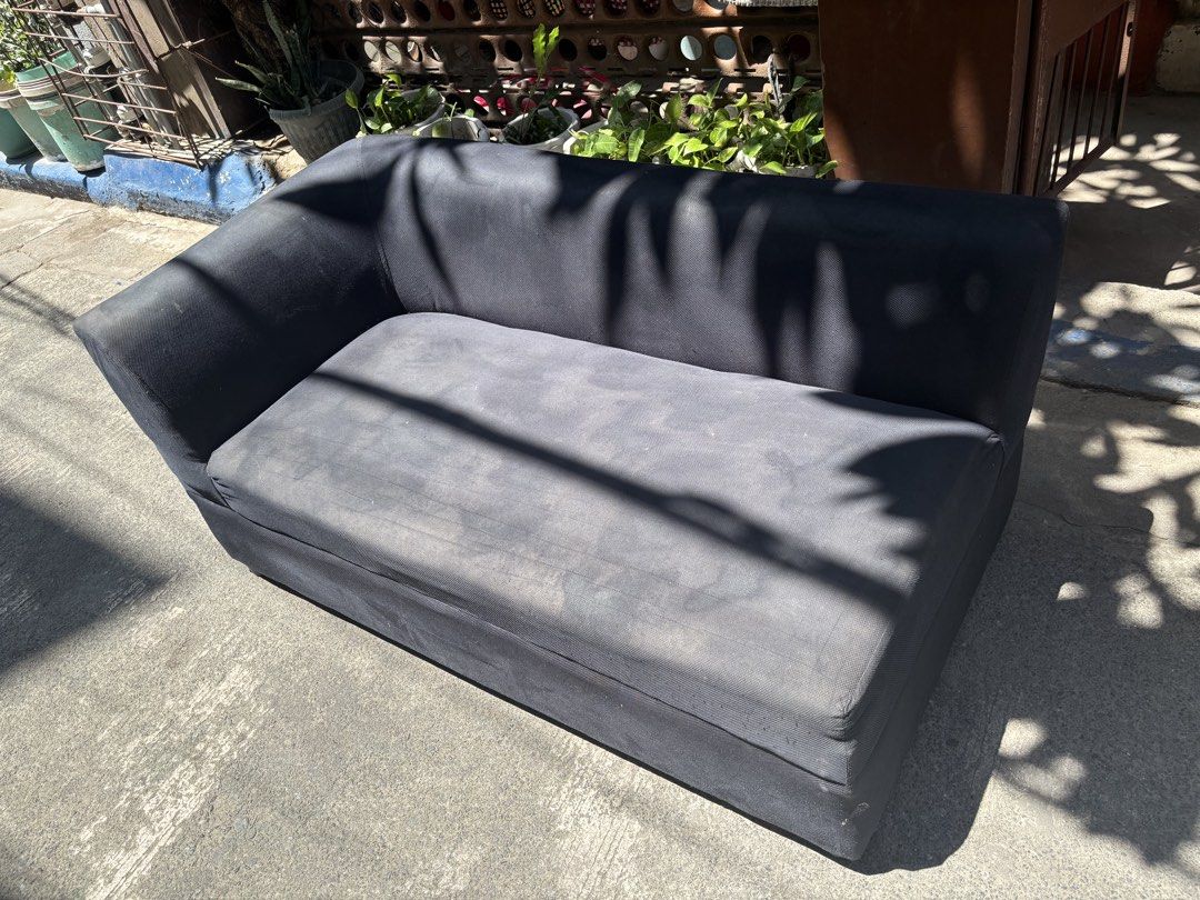 Black Sectional Sofa (Category: Sofas) located in Manila. Submitted by pandesal1021 (Listing ID 1437258731, Image 1). Description: - Black sectional sofa - Single armrest on the left - Rectangular shape - Cushioned seat and back - Soft, possibly velvet-like material.