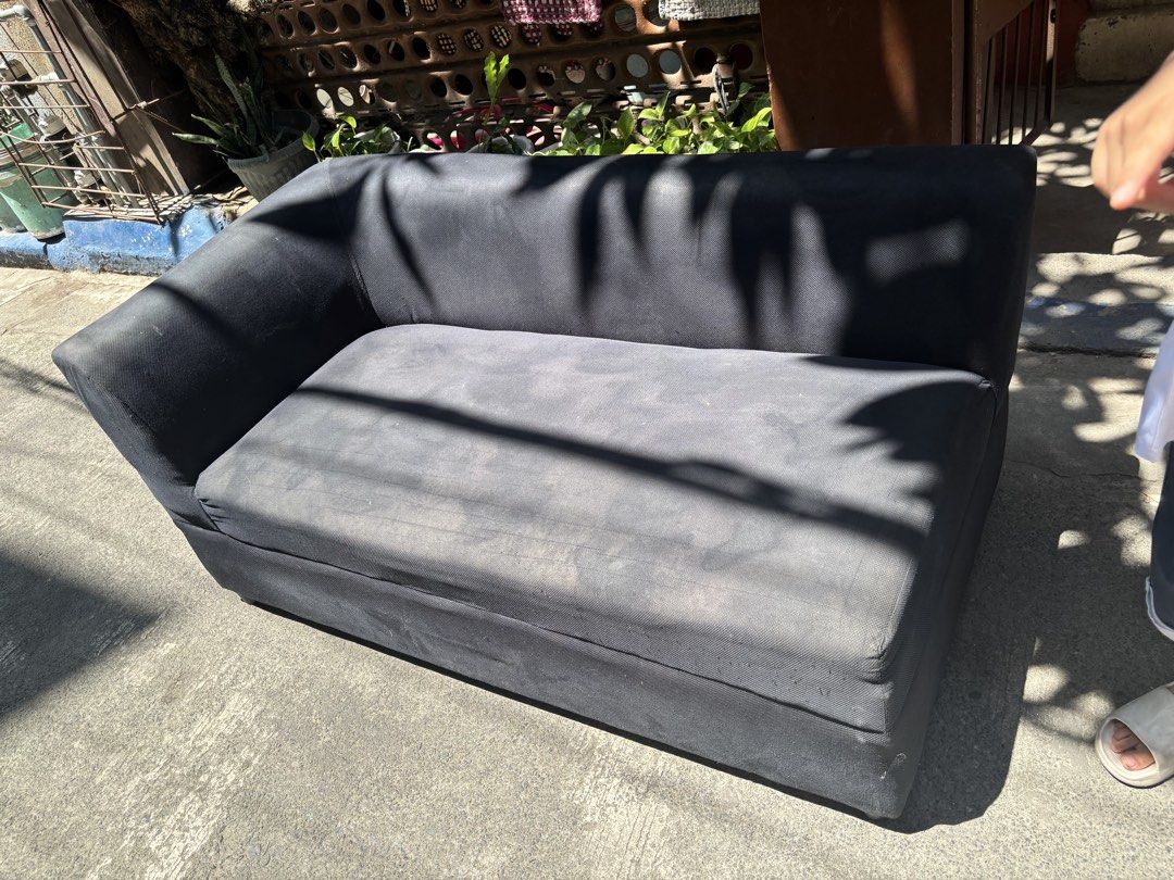 Black Sectional Sofa (Category: Sofas) located in Manila. Submitted by pandesal1021 (Listing ID 1437258731, Image 2). Description: - Black sectional sofa - Single armrest on the left - Rectangular shape - Cushioned seat and back - Soft, possibly velvet-like material.