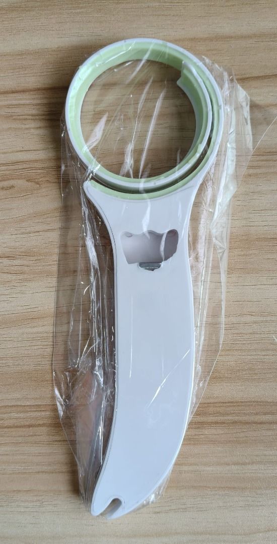 [Brand New!] 3-in-1 Multi-Functional Jar and Bottle Opener (Category: Other Kitchenware & Tableware) located in Singapore. Submitted by xuanc7 (Listing ID 1437343554, Image 1). Description: - This versatile kitchen tool features an adjustable silicone-lined ring to securely grip and open jars of various sizes. - It includes a built-in bottle opener for popping caps off beer and soda bottles. - A small hook at the tip is designed to lift and pull 