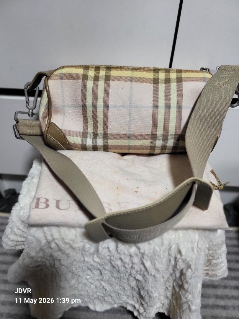 Burberry Shoulder Bag (Category: Luxury Bags & Wallets) located in Pasig City. Submitted by iba_by_jane (Listing ID 1437260500, Image 1). Description: - Authentic Burberry London shoulder bag - Classic check pattern - Beige leather trim and strap - Silver hardware - Includes dust bag - Small Barrel Bag - Needs Dry Cleaning - No Major Flaws, just need cleaning if maselan - What u see is what u get.